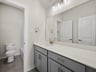 bathroom with quartz countertops & a bathtub with shower combo