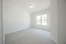 guest bedroom with carpet and walk-in closet