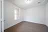 open study with hardwood flooring and glass french doors
